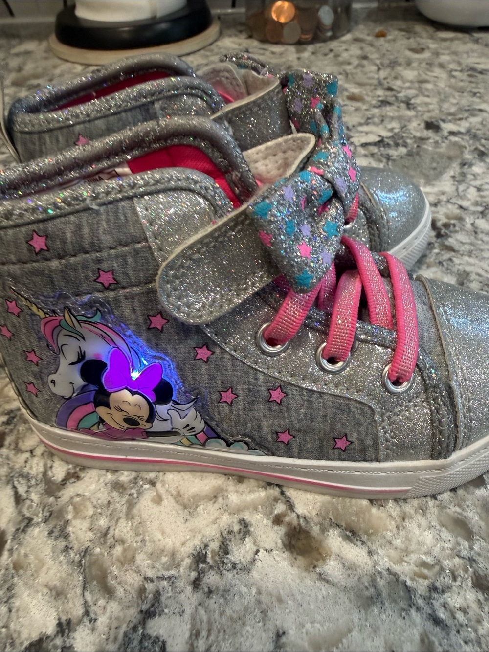 Disney Minnie-Mouse light-up high-top sneakers.